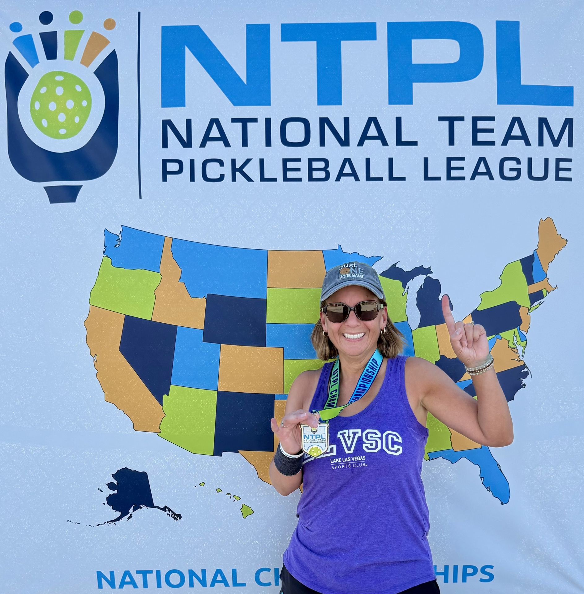 Rita coaching a group of players on the pickleball court